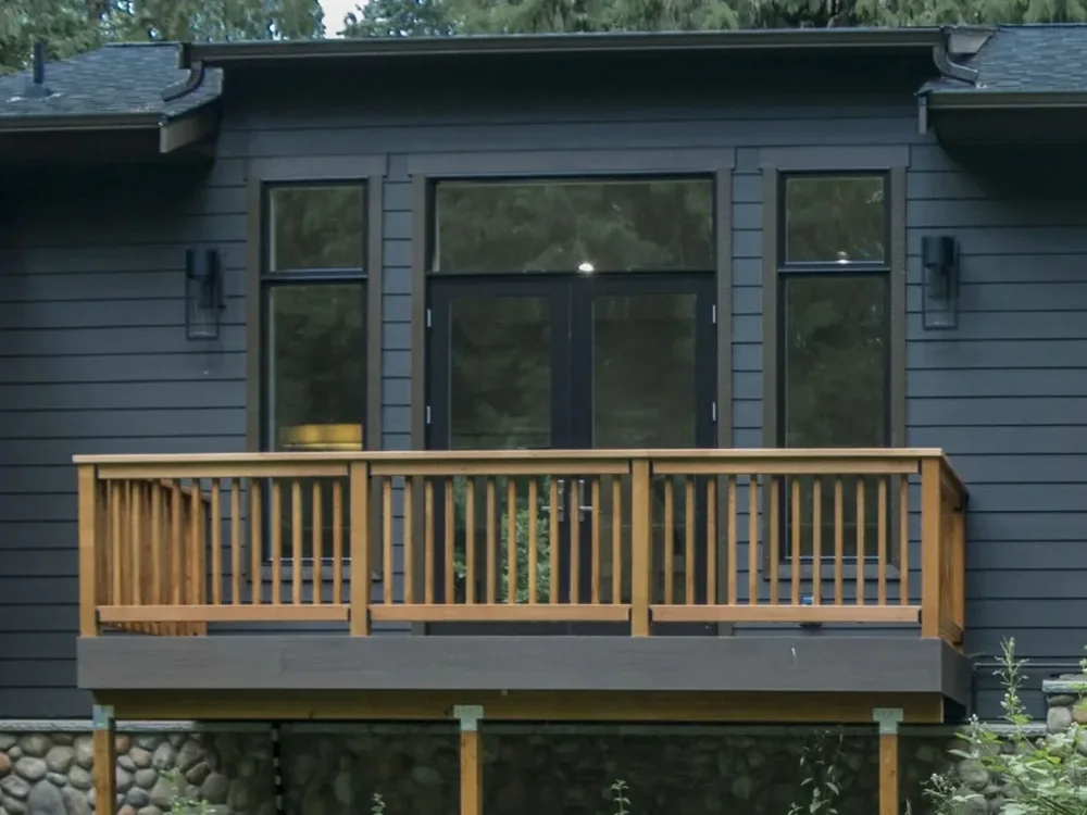 Detail of a wood deck railing and exterior siding